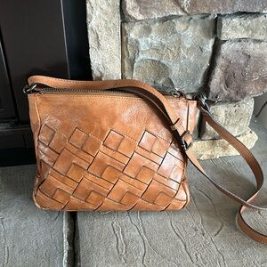 Tan distressed leather crossbody with basket weave leather print distressed